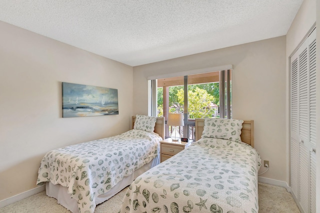 bedroom featuring a closet and a textured ceiling