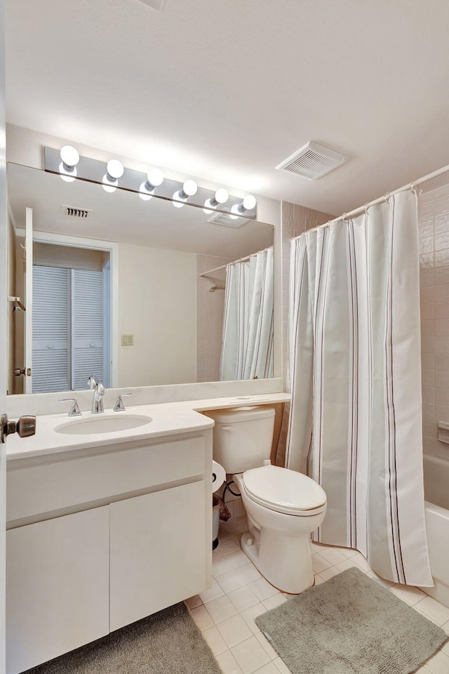 full bathroom with toilet, vanity, shower / tub combo with curtain, and tile patterned flooring