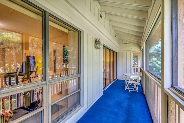 sunroom / solarium with vaulted ceiling