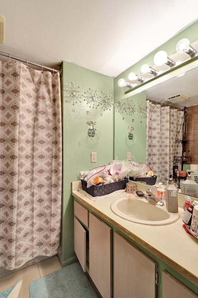 bathroom featuring vanity and tile patterned flooring