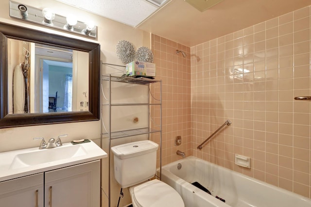 full bathroom with vanity, toilet, and tiled shower / bath