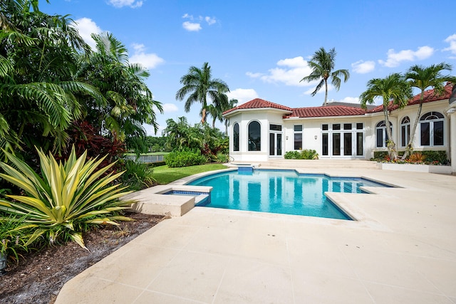 view of swimming pool with a patio area