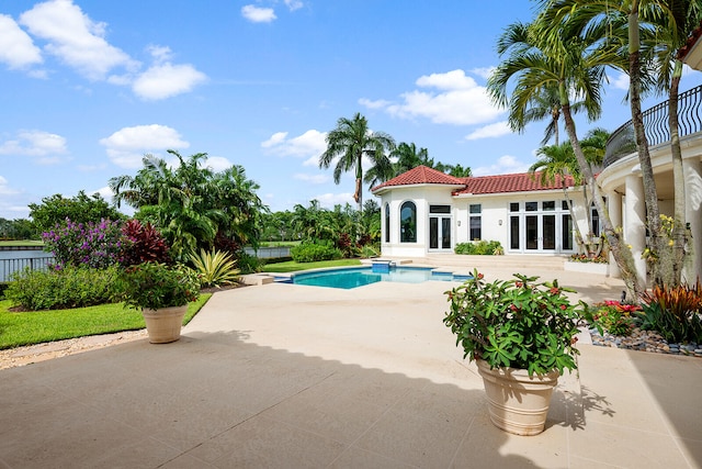 view of swimming pool featuring french doors and a patio area