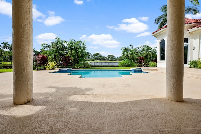 view of swimming pool featuring a patio area