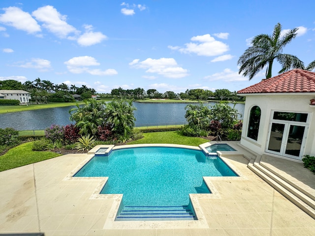 view of pool featuring a water view, french doors, and a patio area