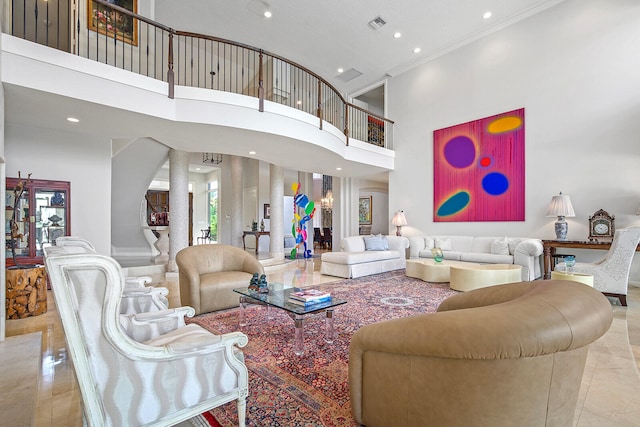 living room featuring crown molding and a towering ceiling