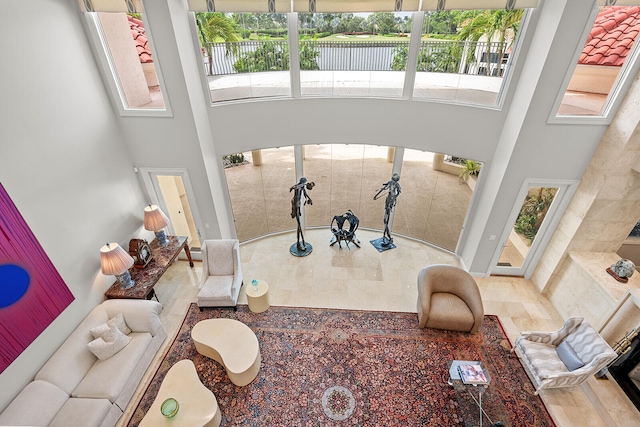 interior space with a towering ceiling and a wealth of natural light