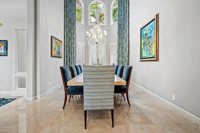 tiled dining area featuring an inviting chandelier