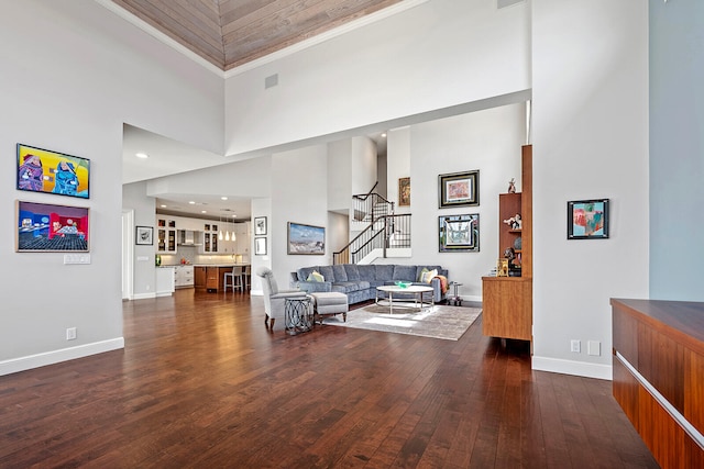 interior space with dark wood-type flooring and a high ceiling