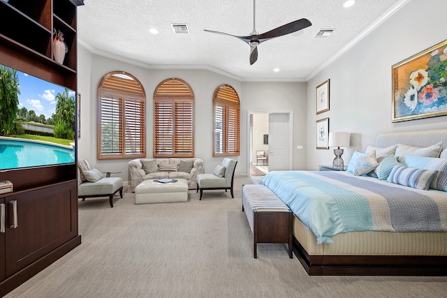 bedroom featuring ornamental molding, light carpet, a textured ceiling, and ceiling fan