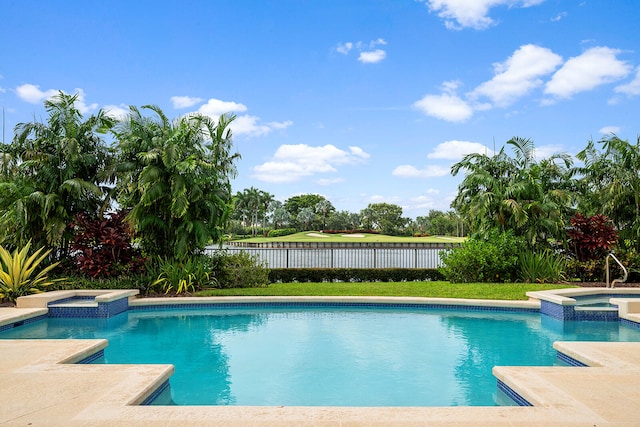 view of pool with an in ground hot tub