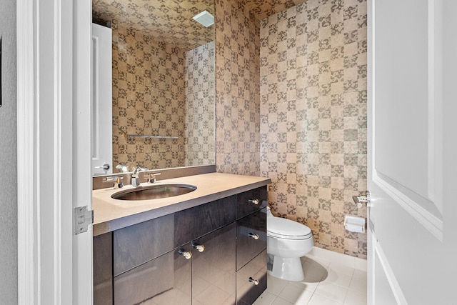 bathroom with tile patterned floors, toilet, and vanity