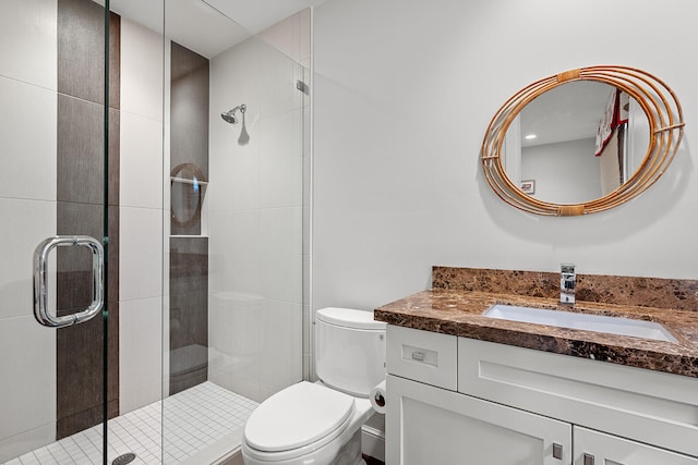 bathroom with vanity, toilet, and walk in shower