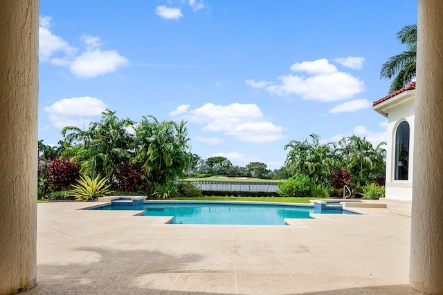 view of swimming pool featuring a patio area