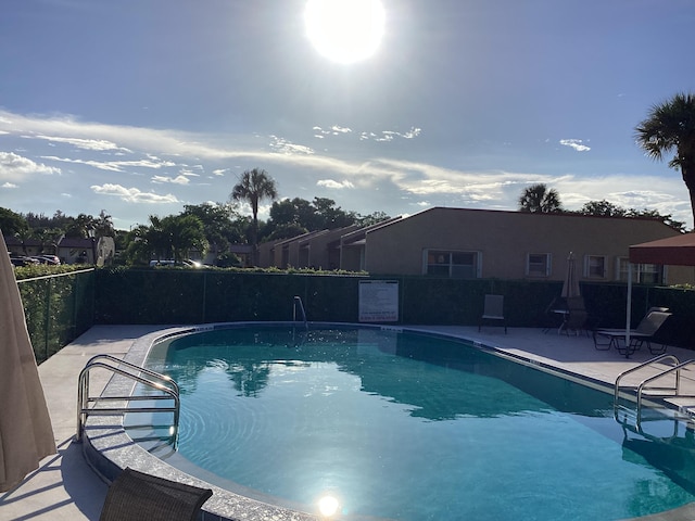 view of swimming pool featuring a patio