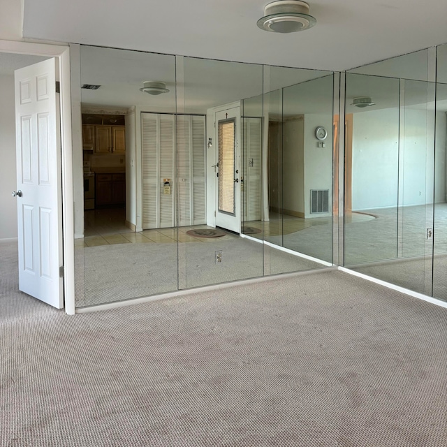 unfurnished bedroom with multiple closets