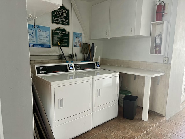 laundry area featuring cabinets and separate washer and dryer