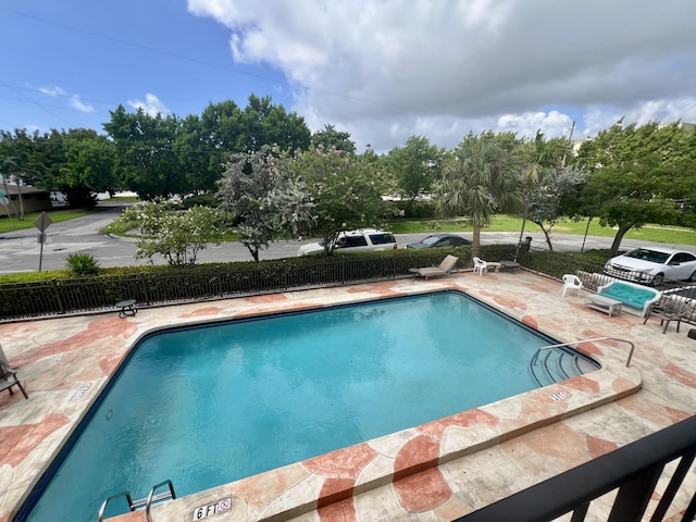 view of pool featuring a patio area