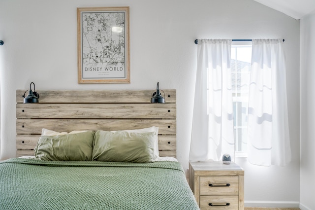 bedroom featuring lofted ceiling