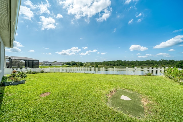 view of yard featuring glass enclosure