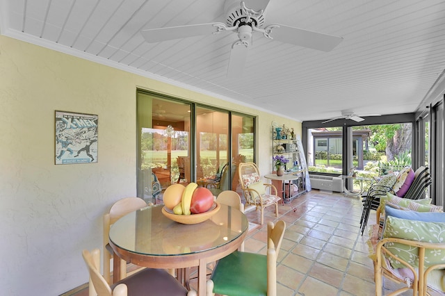 sunroom featuring ceiling fan