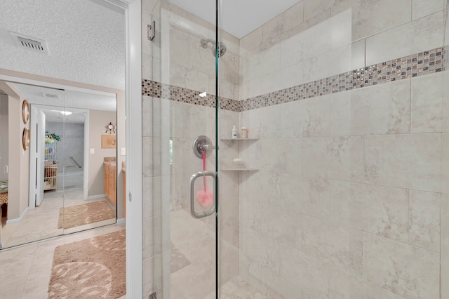 bathroom with walk in shower and tile patterned floors