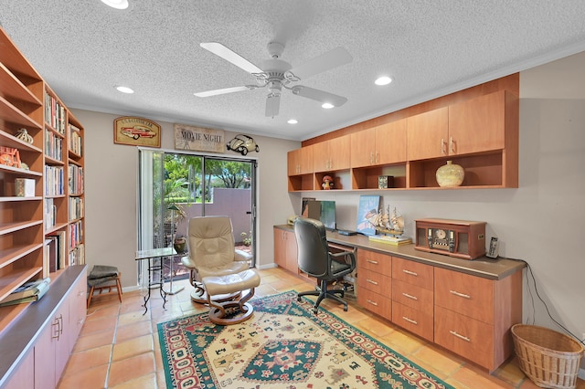 tiled office featuring ornamental molding, a textured ceiling, and ceiling fan