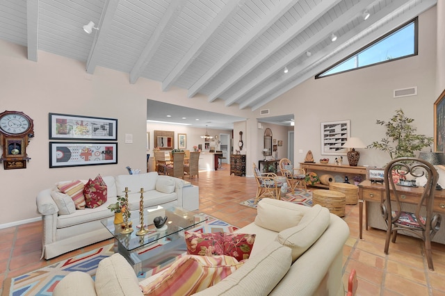 tiled living room featuring beamed ceiling and high vaulted ceiling