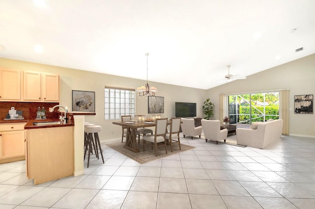 8278 Duomo Cir, Boynton Beach, FL 33472 - dining space featuring a ceiling fan, light tile patterned floors, baseboards, a chandelier, and lofted ceiling