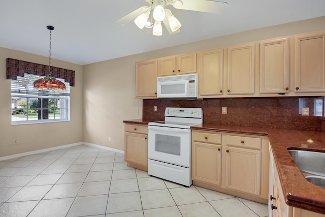 kitchen featuring decorative backsplash, light tile patterned floors, pendant lighting, and white appliances