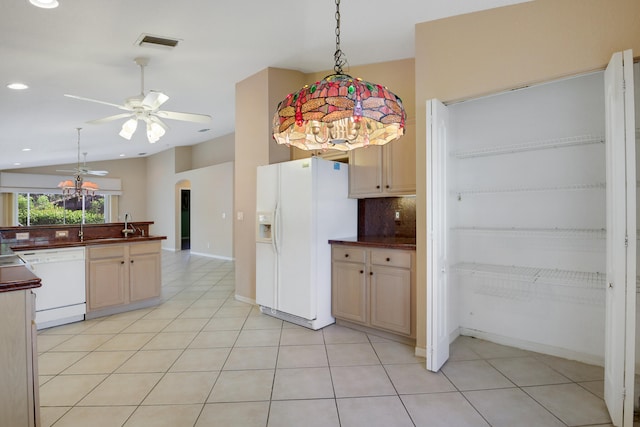 kitchen featuring light tile patterned floors, white appliances, ceiling fan, and lofted ceiling