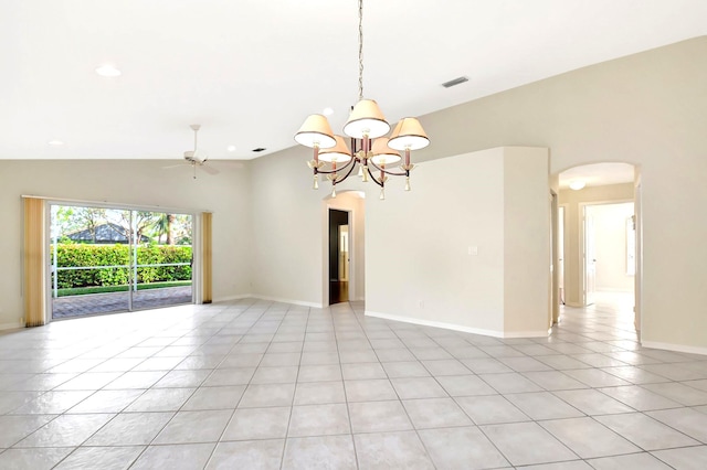 spare room featuring lofted ceiling, ceiling fan with notable chandelier, and light tile patterned floors