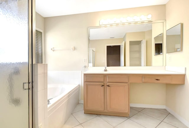 bathroom featuring vanity, tile patterned flooring, and plus walk in shower