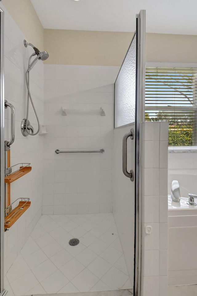 bathroom featuring a shower with shower door