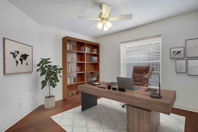 office space with hardwood / wood-style floors and ceiling fan