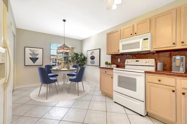 8278 Duomo Cir, Boynton Beach, FL 33472 - kitchen with white appliances, backsplash, light tile patterned floors, and baseboards