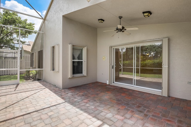 view of patio / terrace with a lanai and ceiling fan