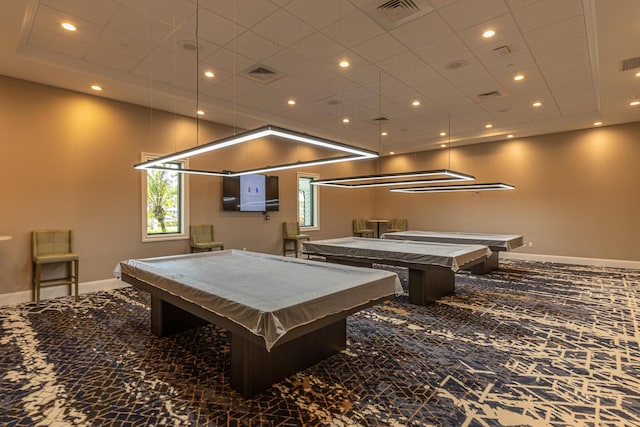 recreation room featuring billiards, a tray ceiling, and carpet