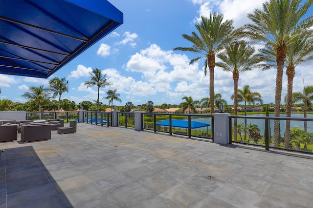 view of patio featuring an outdoor living space and a water view