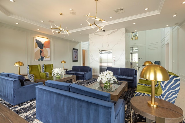 living room with a notable chandelier, a tray ceiling, ornamental molding, and elevator