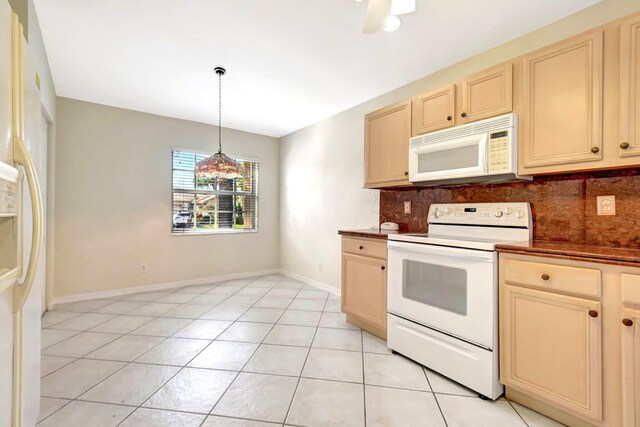 unfurnished living room with light tile patterned floors and ceiling fan with notable chandelier