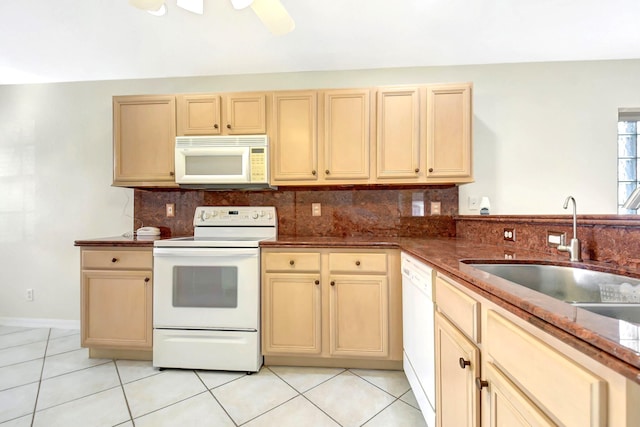 kitchen with tasteful backsplash, white appliances, sink, and light brown cabinets