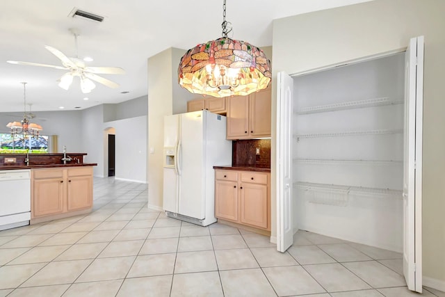 8278 Duomo Cir, Boynton Beach, FL 33472 - kitchen with white appliances, arched walkways, a chandelier, dark countertops, and recessed lighting