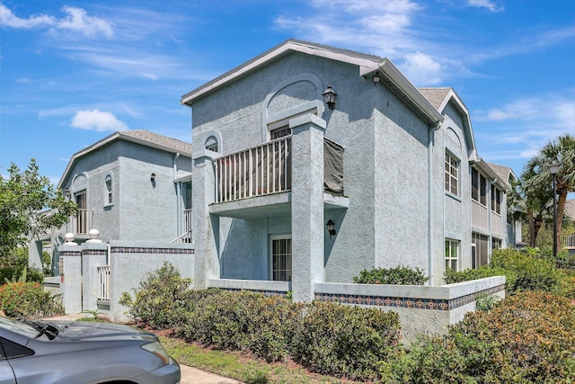 view of home's exterior featuring a balcony