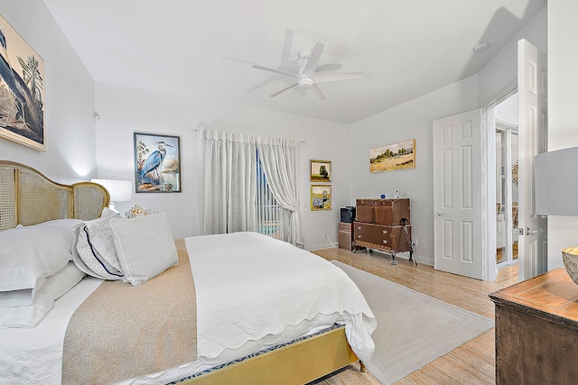 bedroom featuring ceiling fan and light wood-type flooring