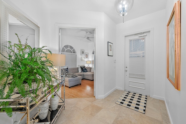 entryway featuring light wood-type flooring and ceiling fan