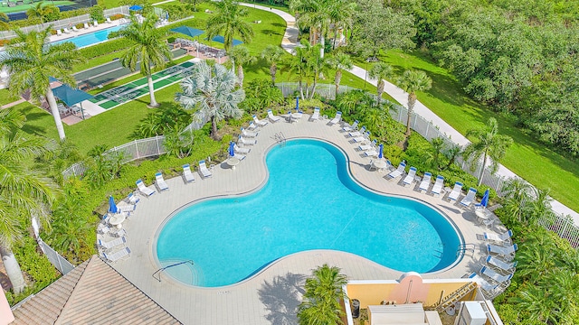 view of swimming pool featuring a patio area and a lawn