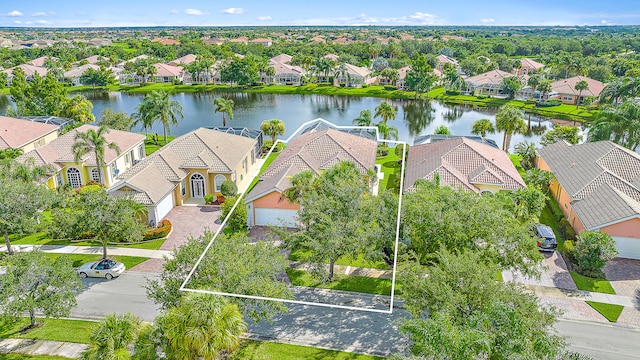 birds eye view of property with a water view