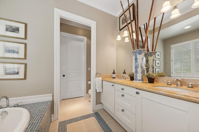 bathroom featuring vanity, tile patterned floors, toilet, and a relaxing tiled tub