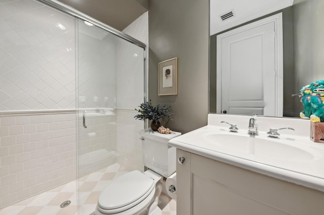 bathroom with walk in shower, vanity, and toilet